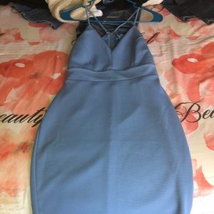 a baby blue dress with lace in the back and zipper